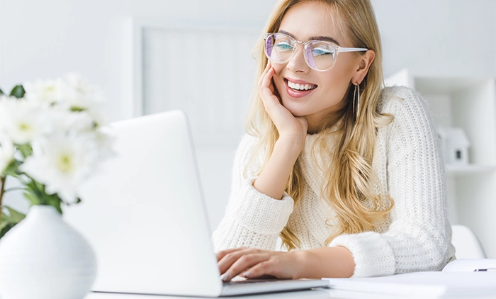Woman using her laptop computer at home