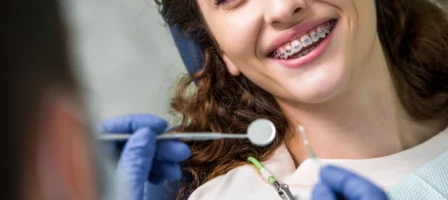 Teenager With Braces Receiving A Dental Exam