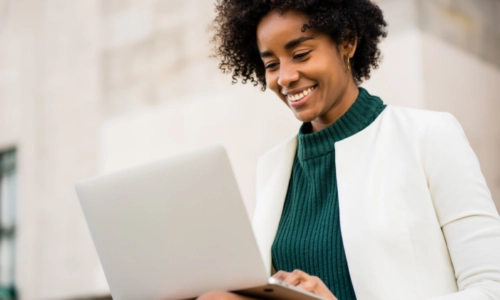 Woman typing on laptop computer