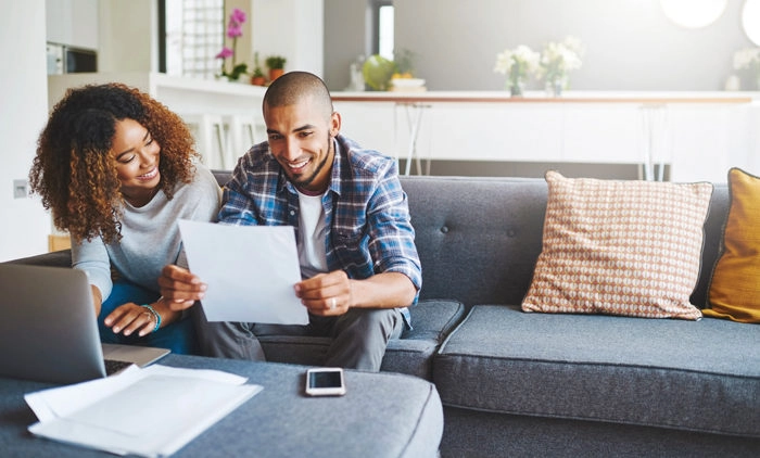 Couple doing paperwork together at home