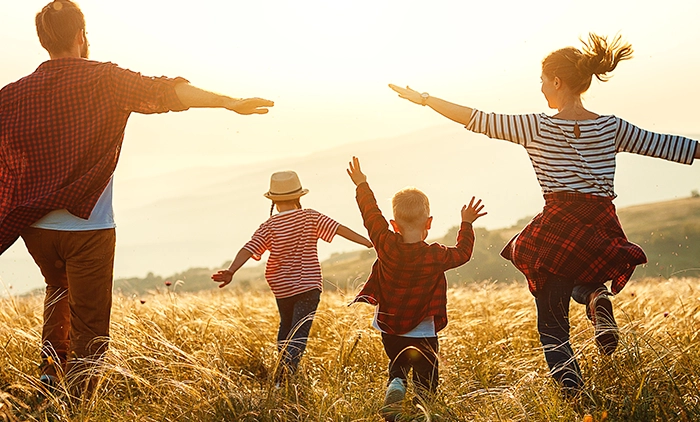 Family playing in a field