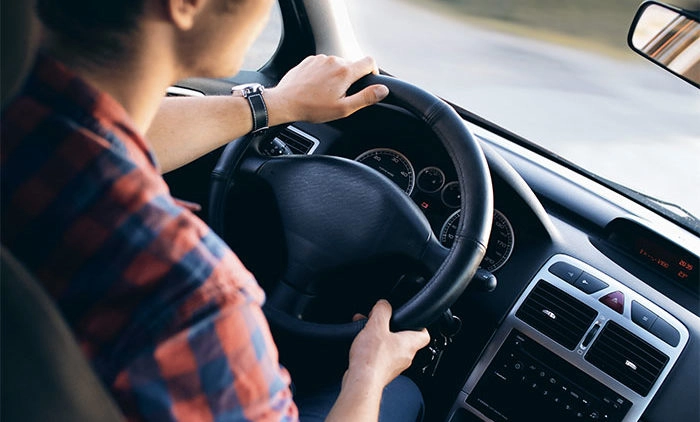 Person driving a car